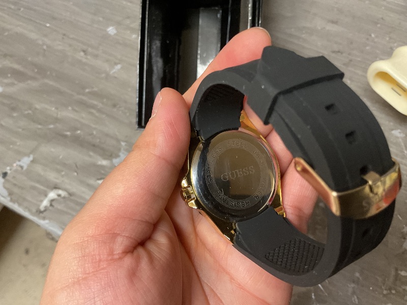 Photo 1 of GUESS Gold-Tone Stainless Steel + Black Stain Resistant Watch with Day + Date Functions. Color: Black (Model: U1053L7)