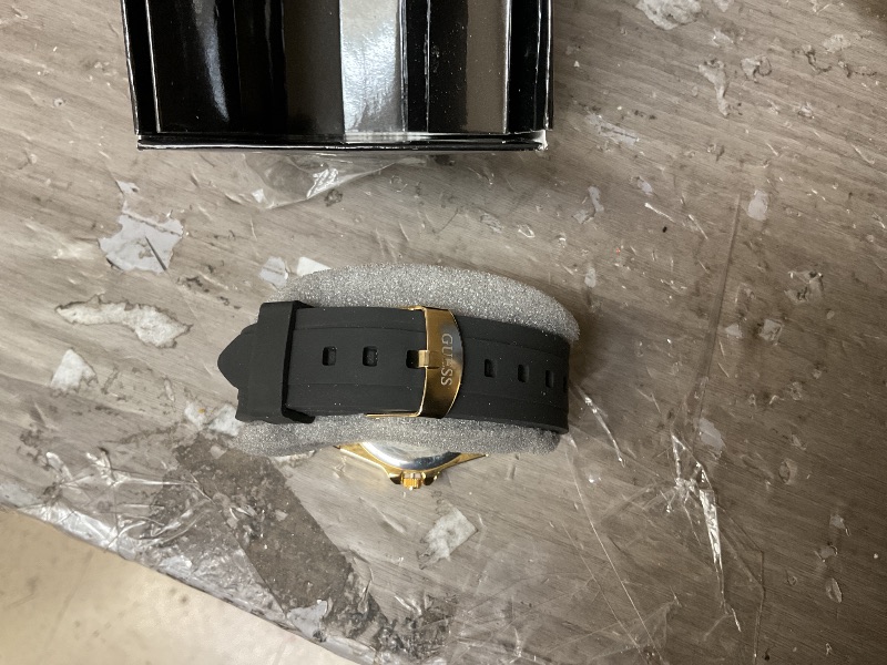 Photo 1 of GUESS Gold-Tone Stainless Steel + Black Stain Resistant Watch with Day + Date Functions. Color: Black (Model: U1053L7)