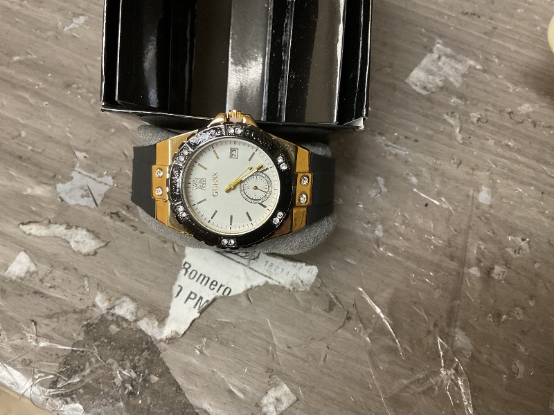 Photo 1 of GUESS Gold-Tone Stainless Steel + Black Stain Resistant Watch with Day + Date Functions. Color: Black (Model: U1053L7)