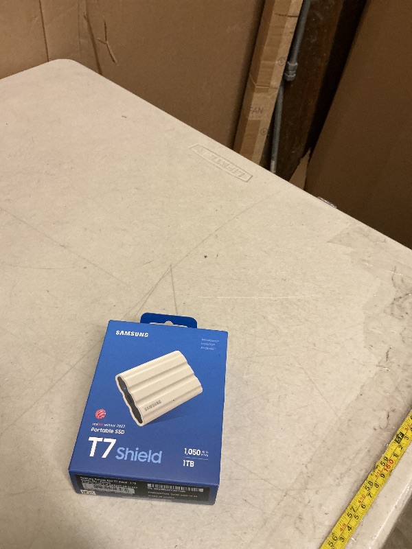 Photo 1 of Samsung T7 Shield Portable External Solid State Drive USB 3.2 1TB, IP65 Water Resistant, Compatible with PC/Mac/Android/Gaming Consoles (MUPE1T0K/AM), Beige