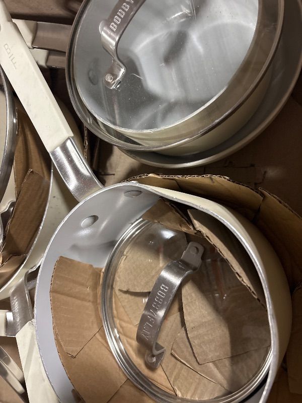 Photo 4 of **HAS DAMAGE**
GreenPan x Bobby Flay 13 Piece Nonstick Cookware Pots and Pans Set, PFAS-Free Diamond Ceramic, Induction Suitable, Easy Clean Dishwasher & Oven Safe, Stay-Cool Silicone Handles, Glass Lids, Cream