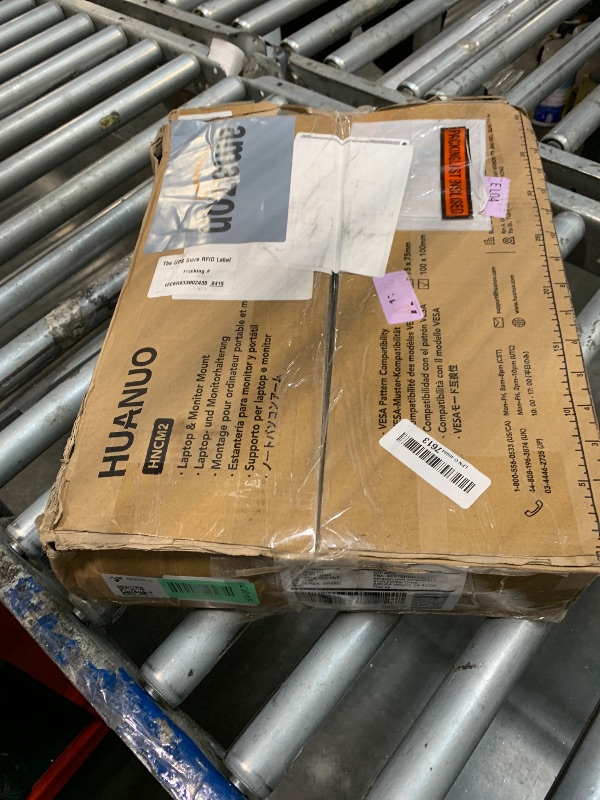 Photo 1 of HUANUO Adjustable Monitor Stand, Single Arm Desk Mount for 32 inch Screen and 17 inch Laptop, Heavy Duty Ergonomic Bracket Holds 22lbs