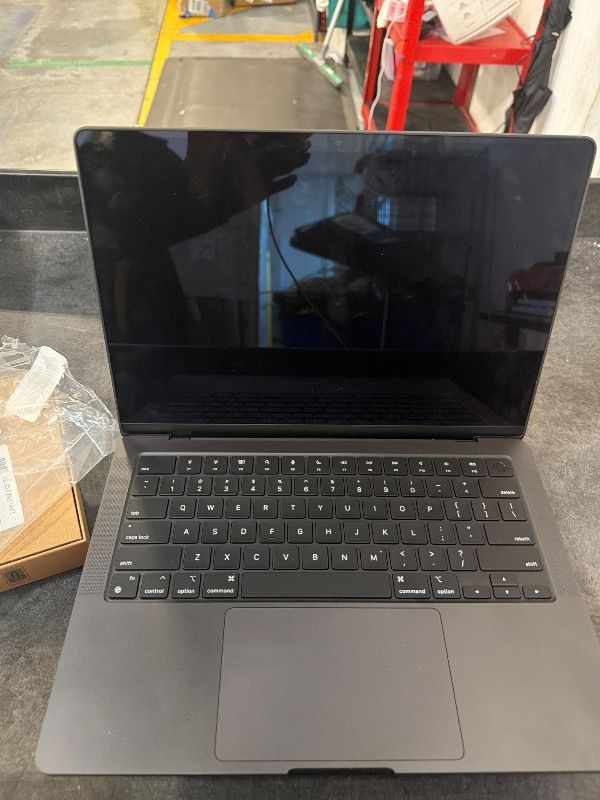 Photo 1 of **AS IS, FINAL SALE** Apple 2024 MacBook Pro Laptop with M4 Pro, 14?core CPU, 20?core GPU: Built for Apple Intelligence, 14.2-inch Liquid Retina XDR Display, 24GB Unified Memory, 1TB SSD Storage; Space Black