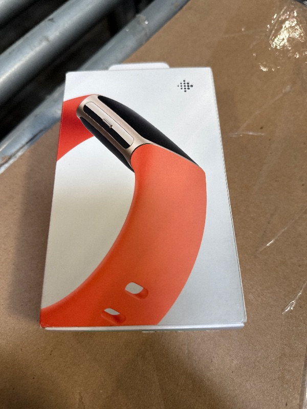 Photo 1 of ** MISSING CHARGER***Fitbit Charge 6 Fitness Tracker with Google apps, Heart Rate on Exercise Equipment, 6-Months Premium Membership Included, GPS, Health Tools and More, Gold/Coral, One Size (S & L Bands Included)