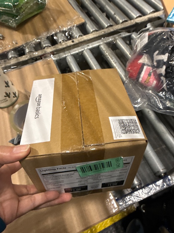 Photo 1 of **SEE CLERK NOTES**
Amazon Basics Smart A19 LED Light Bulb, Color Changing, 9W (60W Equivalent), 800LM, Works with Alexa Only, 2.4 GHz Wi-Fi, No Hub Required, 4 Pack