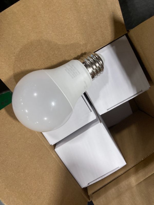 Photo 1 of **SEE CLERK NOTES**
Amazon Basics Smart A19 LED Light Bulb, Color Changing, 9W (60W Equivalent), 800LM, Works with Alexa Only, 2.4 GHz Wi-Fi, No Hub Required, 4 Pack