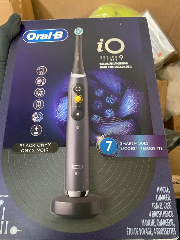 Photo 1 of Oral-B Rechargeable Electric Toothbrush, iO9 Genius, 7 Cleaning Modes, Interactive Display, Charging Travel Case, Visible Pressure Sensor, 4 Brush Heads, Black