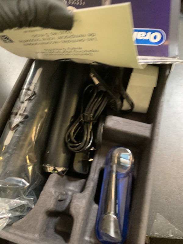 Photo 1 of Oral-B Rechargeable Electric Toothbrush, iO9 Genius, 7 Cleaning Modes, Interactive Display, Charging Travel Case, Visible Pressure Sensor, 4 Brush Heads, Black