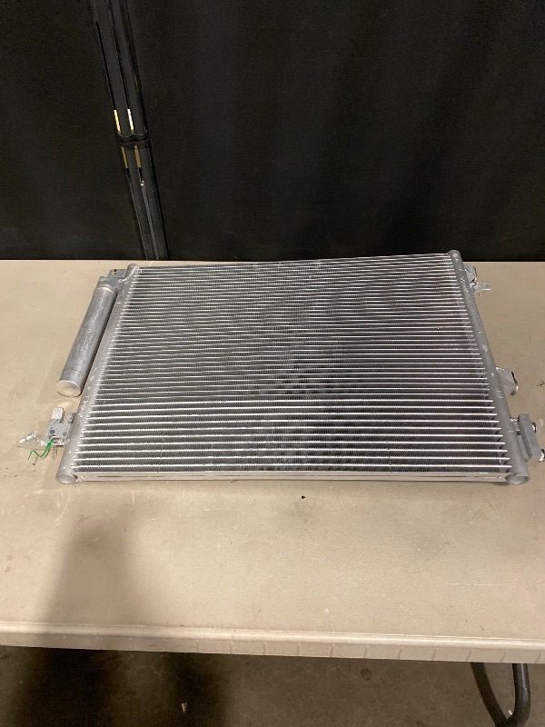 Photo 1 of Car air conditioning condenser This type of condenser is compatible with several vehicle models, including: Nissan Qashqai II, Nissan X-Trail, Renault Kadjar