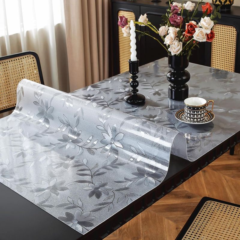 Photo 1 of Floral Table Protector 28 x 60 Inch, 1.5mm Thick Plastic Table Cover, Waterproof Desk Protector Mat Desk Cover Rectangle Vinyl Tabletop Protector for Home Office Desktop