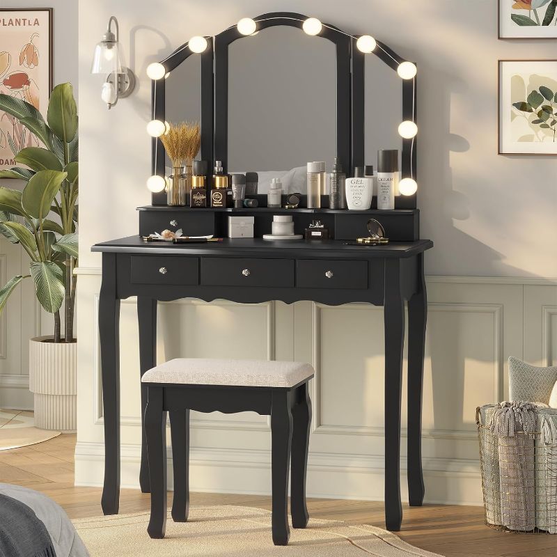 Photo 1 of Vanity Desk, Makeup Vanity with Lighted Tri-fold Mirror and Stool, Vanity Set with 5 Drawers, 3 Light Settings & Adjustable Brightness, Black