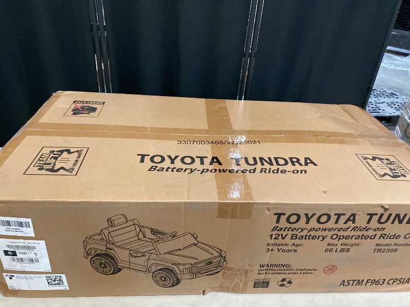 Photo 1 of 12V Ride on Car for Kids, Licensed Toyota Ride on Truck, Battery Powered Electric Car with Music, LED Lights, Suspension System, Double Doors, Safety Belt, Ride On Toys for Kids (Grey)