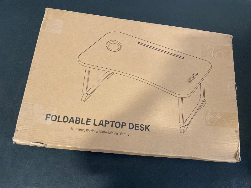 Photo 1 of Foldable Lap Desk for Laptop & Writing - 23 inch Bed Tray Table with Cup Holder & Tablet Slot - Portable Notebook Stand for Eating, Sofa, Couch & WFH Students (Black)