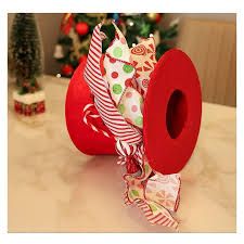 Photo 1 of Candy Cane Christmas Tree Topper, Large Red Tree Topper Hat with Candy Peppermint Bows Ribbon Ornament, Top Hat Christmas Tree Topper for Home Office Holiday Tree Decoration Xmas Gift