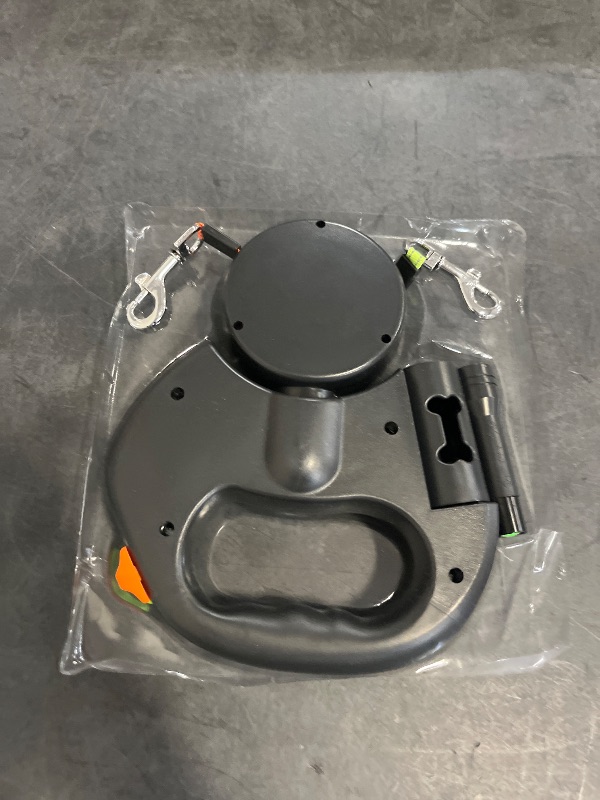 Photo 1 of Dog leash that features an automatic retractable design