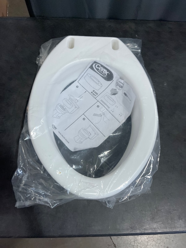 Photo 1 of Carex Toilet Seat Riser, Elongated Raised Toilet Seat Adds 3.5 inches to Toilet Height, for Assistance Bending or Sitting, 300 Pound Weight Capacity Toilet Riser