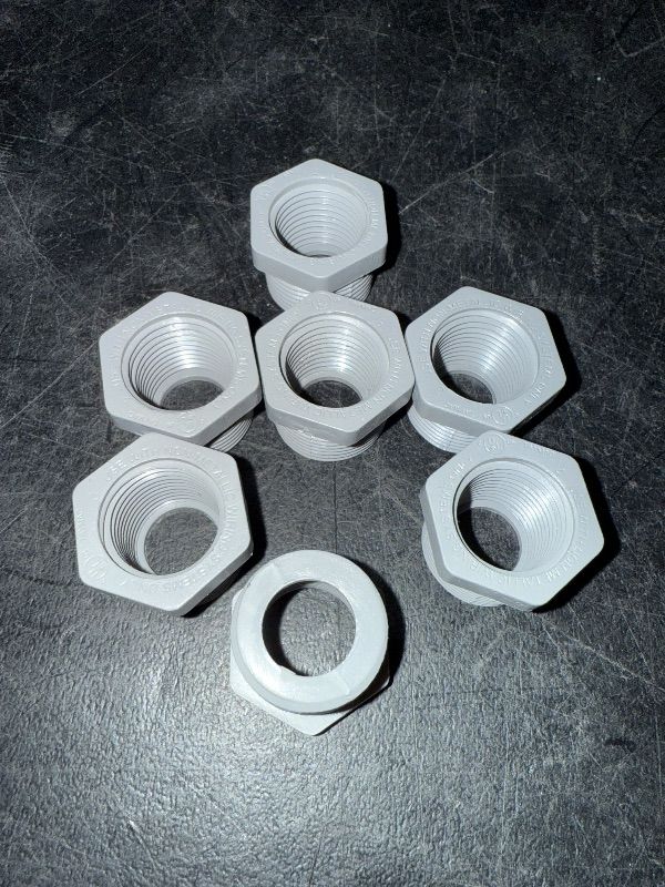 Photo 1 of 3/4" Male x 1/2" Female Threaded Reducer Bushing for PVC Pipe Fitting (Pack of 7) with Carlon E940d-ctn Pvc Conduit Coupling, 1/2"