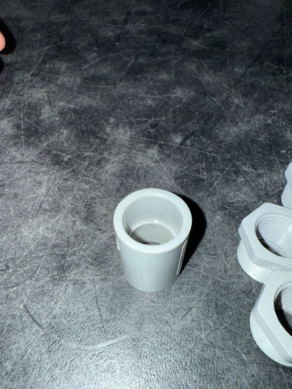 Photo 1 of 3/4" Male x 1/2" Female Threaded Reducer Bushing for PVC Pipe Fitting (Pack of 7) with Carlon E940d-ctn Pvc Conduit Coupling, 1/2"