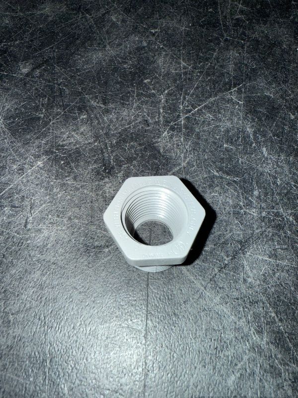 Photo 1 of 3/4" Male x 1/2" Female Threaded Reducer Bushing for PVC Pipe Fitting (Pack of 7) with Carlon E940d-ctn Pvc Conduit Coupling, 1/2"