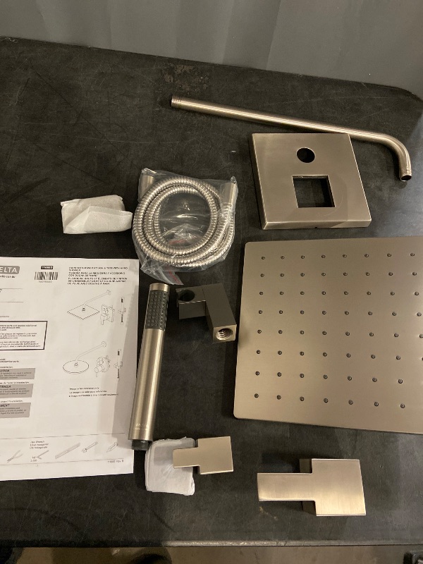 Photo 1 of Delta Modern 14 Series Square Rain Shower System Faucet Set, Rainfall Chrome Shower Head and Handle Set, Valve Trim Kit, 10 Inch, Chrome (Valve Not Included) missing some hardware