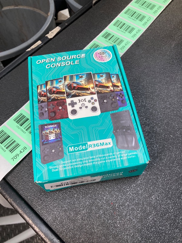 Photo 1 of **MISSING CHARGER**R36MAX Handheld Game Console, Built-in 4000mAh Battery, 4K HD 4" IPS Glass Screen, Supports 18000+ Classic Games, Linux-Based Retro Gaming Console (Black)