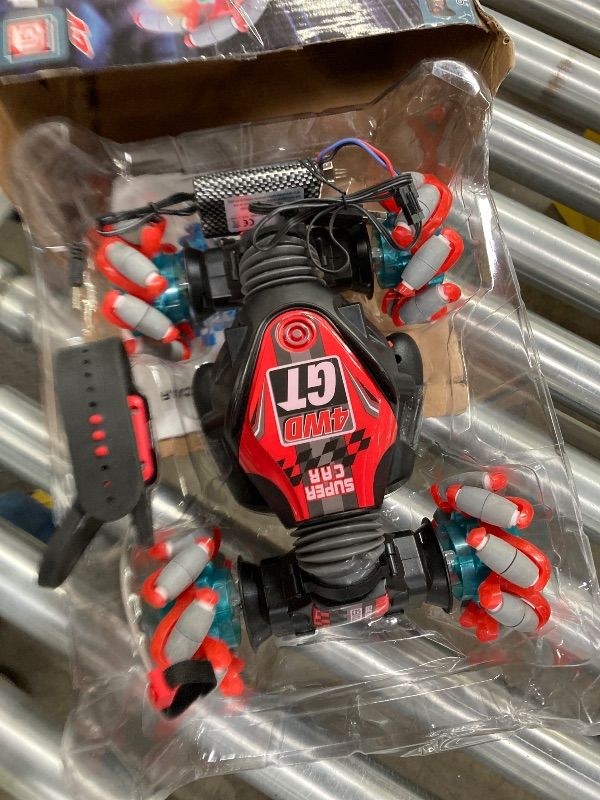 Photo 1 of 1:12 Gesture Sensing RC Stunt Car, 2 * 1200mAh Hand Controlled Remote Control Twist Cars with Light & Music, 4WD 360° Rotate Transform Drift, Gifts for 8-12 Kids Age 8 9 10 11 12 Yrs Old? Trains-Red