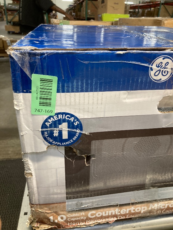 Photo 1 of ***DAMAGED -DENTED SIDE SELLING AS IS*** GE GCST10A1WSS 1.0 Cu Ft Convection Microwave Oven, 1050W Countertop Air Fry Microwave with Broil & Crisper Pan, Compact Stainless Steel Design