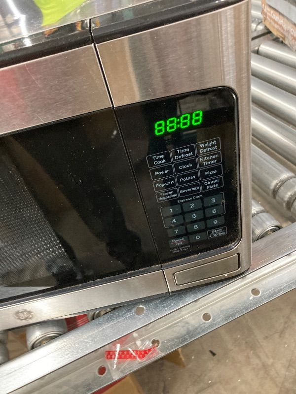 Photo 1 of ***DAMAGED -DENTED SIDE SELLING AS IS*** GE GCST10A1WSS 1.0 Cu Ft Convection Microwave Oven, 1050W Countertop Air Fry Microwave with Broil & Crisper Pan, Compact Stainless Steel Design