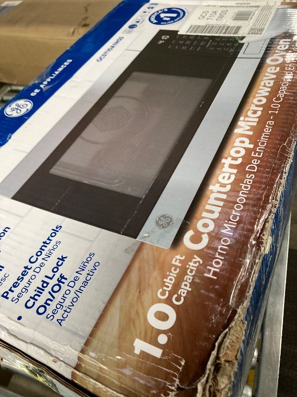Photo 1 of ***DAMAGED -DENTED SIDE SELLING AS IS*** GE GCST10A1WSS 1.0 Cu Ft Convection Microwave Oven, 1050W Countertop Air Fry Microwave with Broil & Crisper Pan, Compact Stainless Steel Design