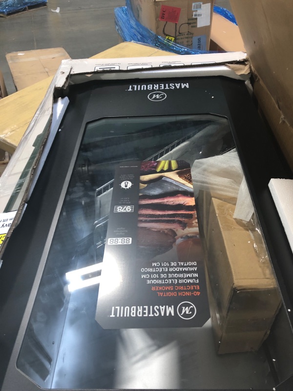 Photo 1 of ***HAS DENTS&******Masterbuilt® 40-inch Digital Electric Vertical BBQ Smoker with Leg Kit, Side Wood Chip Loader and 970 Cooking Square Inches in Black, Model MB20070122