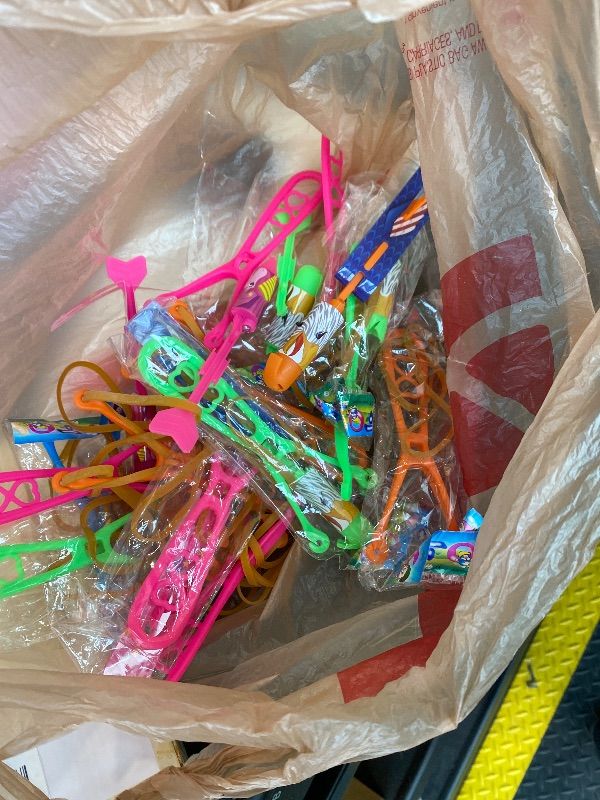 Photo 1 of ***MISSING PIECES*** Ynybusi 50 Pcs Slingshot Flying Toys with Led Lights,25 Pcs LED Arrow Helicopters + 25 Pcs Launchers,Summer Outdoor Game Glow in The Dark Party Supplies Party Favors for Kids 4-8,8-12 Bulk Toys