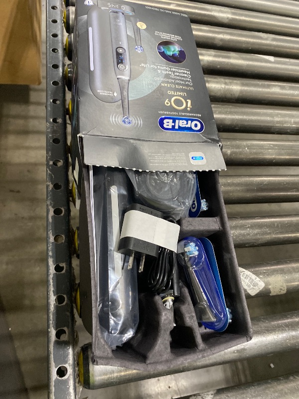 Photo 1 of Oral-B Rechargeable Electric Toothbrush, iO9 Limited Ultimate Clean, 7 Cleaning Modes, Interactive Display, iSense Charger, Charging Travel Case, Visible Pressure Sensor, 3 Brush Heads, Black
