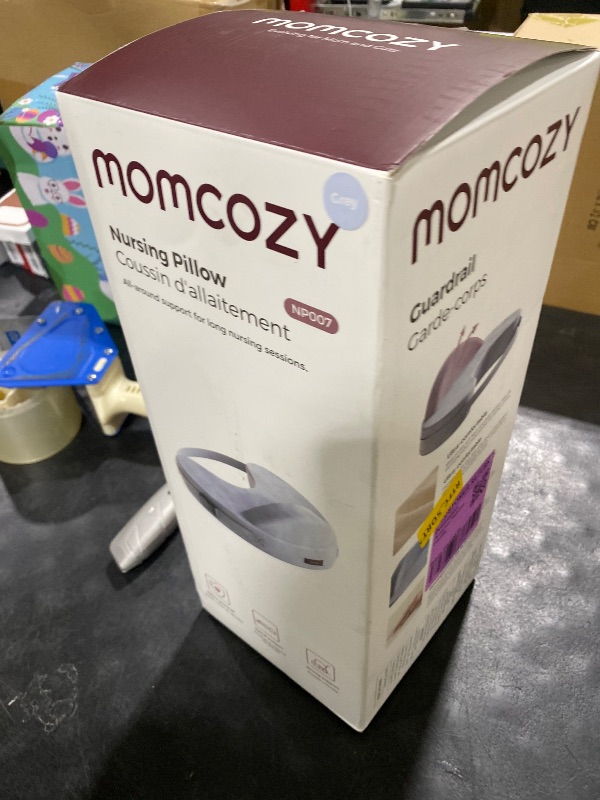 Photo 1 of Momcozy Innovative Safety Guard Nursing Pillow - Firm & Springy Memory Foam - Stable, Ergonomic Support & Comfort - Wider Breastfeeding Cushion, Adjustable, Removable Cover, Baby Safety Certified