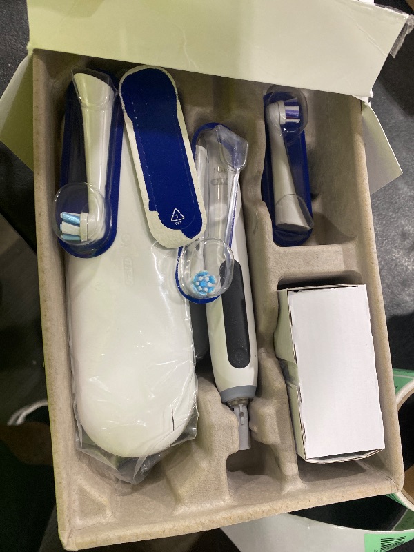 Photo 1 of Oral-B Rechargeable Electric Toothbrush, iO5 Limited Deep Clean & Whiten, 5 Cleaning Modes, Visual Pressure Sensor to Protect Gums, Travel Case, 3 Brush Heads, White