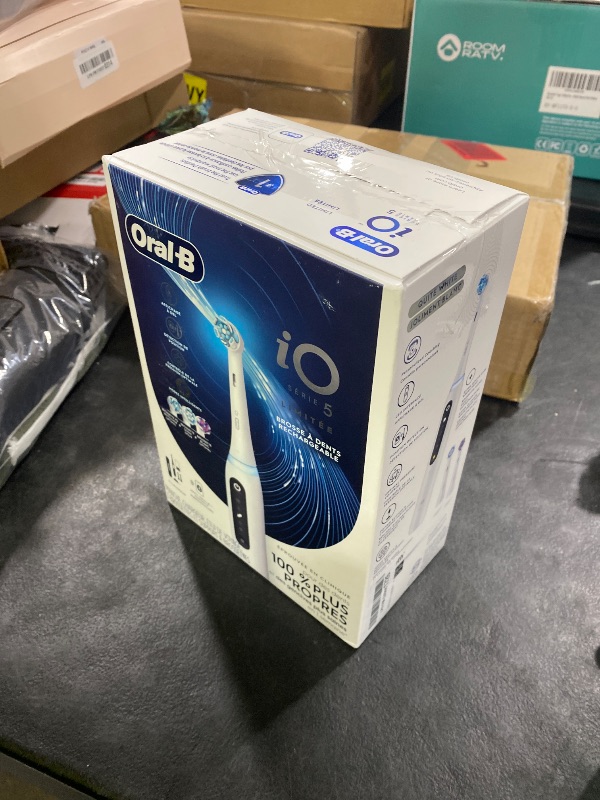 Photo 1 of Oral-B Rechargeable Electric Toothbrush, iO5 Limited Deep Clean & Whiten, 5 Cleaning Modes, Visual Pressure Sensor to Protect Gums, Travel Case, 3 Brush Heads, White