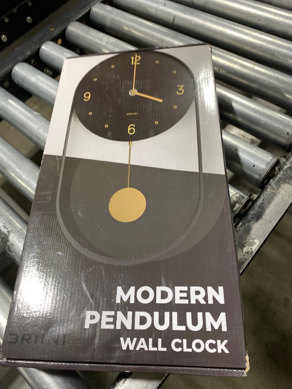 Photo 1 of Driini Modern Pendulum Wall Clock - Black and Gold Decorative Wall Clock with Pendulum - Modern Minimalist Metal Wall Clock for Living Room Décor - Silent Battery Operated Wall Clock
