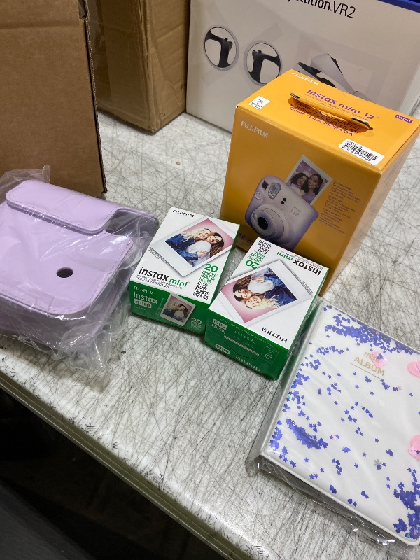 Photo 1 of Fujifilm Instax Mini 12 Instant Camera Lilac Purple + Fuji Film Value Pack (40 Sheets) + Shutter Accessories Bundle, Incl. Compatible Carrying Case, Quicksand Beads Photo Album 64 Pockets