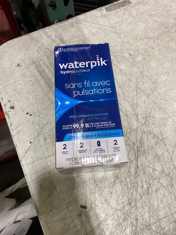 Photo 1 of Waterpik Cordless Pulse Rechargeable Portable Water Flosser for Teeth, Gums, Braces Care and Travel with 2 Flossing Tips, Waterproof, ADA Accepted, WF-20 White, Packaging May Vary
