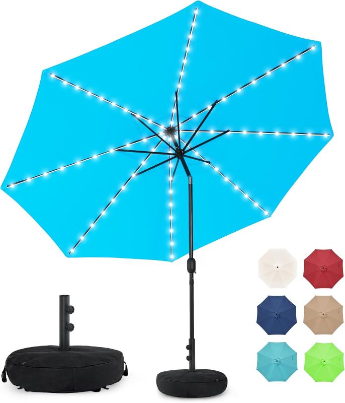 Photo 1 of Sundale Outdoor Solar 80 LED 9 ft Patio Umbrella with Sand Bag Umbrella Base, Outdoor Umbrella with Tilt and Crank, SKY BLUE