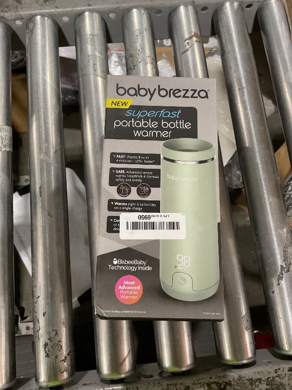 Photo 1 of Baby Brezza Portable Warmer – 67% Faster Baby Bottle Warming - Travel Breastmilk and Formula Warmer - Safe, Even Heating - Up to 9oz - No Adapters, Green