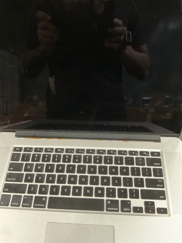 Photo 1 of (used/fair) (mid 2015) Apple MacBook Pro 15-Inch Laptop with Retina Display (2.2 GHz Intel Core i7 Processor, 16GB RAM, 256GB SSD) (Renewed)