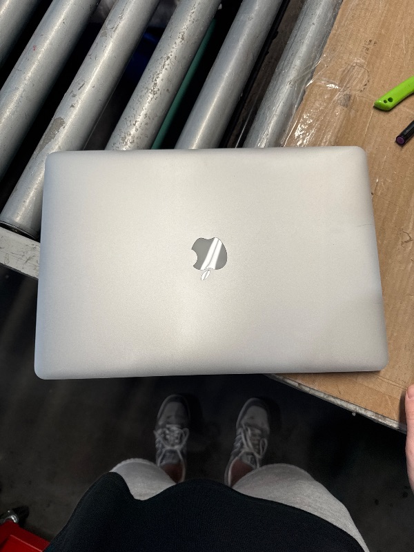 Photo 1 of (used/fair) (mid 2015) Apple MacBook Pro 15-Inch Laptop with Retina Display (2.2 GHz Intel Core i7 Processor, 16GB RAM, 256GB SSD) (Renewed)