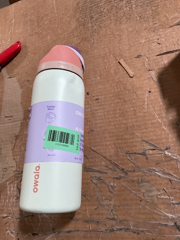 Photo 1 of * has a dent and is dirty * 
Owala FreeSip Insulated Stainless Steel Water Bottle with Straw for Sports, Travel, and School BPA-Free Sports Water Bottle, 32 oz, Surfs Edge
