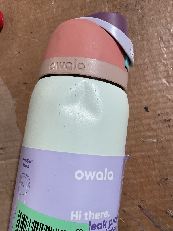 Photo 1 of * has a dent and is dirty * 
Owala FreeSip Insulated Stainless Steel Water Bottle with Straw for Sports, Travel, and School BPA-Free Sports Water Bottle, 32 oz, Surfs Edge