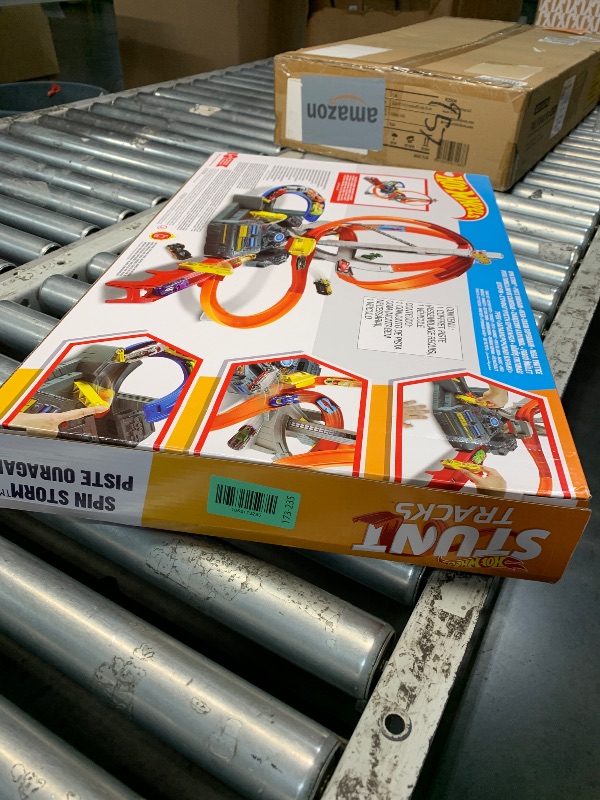 Photo 1 of ***FACTORY SEALED*** Hot Wheels Track Set Spin Storm, 3 Intersections for Crashing & Motorized Booster, 1:64 Scale Toy Car (Amazon Exclusive)