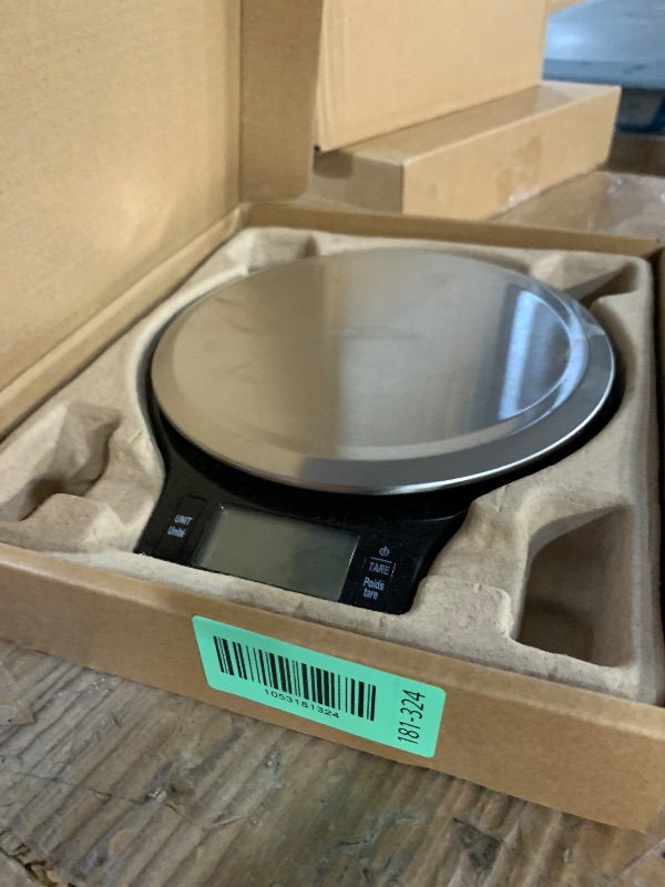 Photo 1 of ***(HEAVILY USED/ MINOR DAMAGE)***Amazon Basics Digital Kitchen Scale with LCD Display, Batteries Included, Weighs up to 11 pounds, Black and Stainless Steel