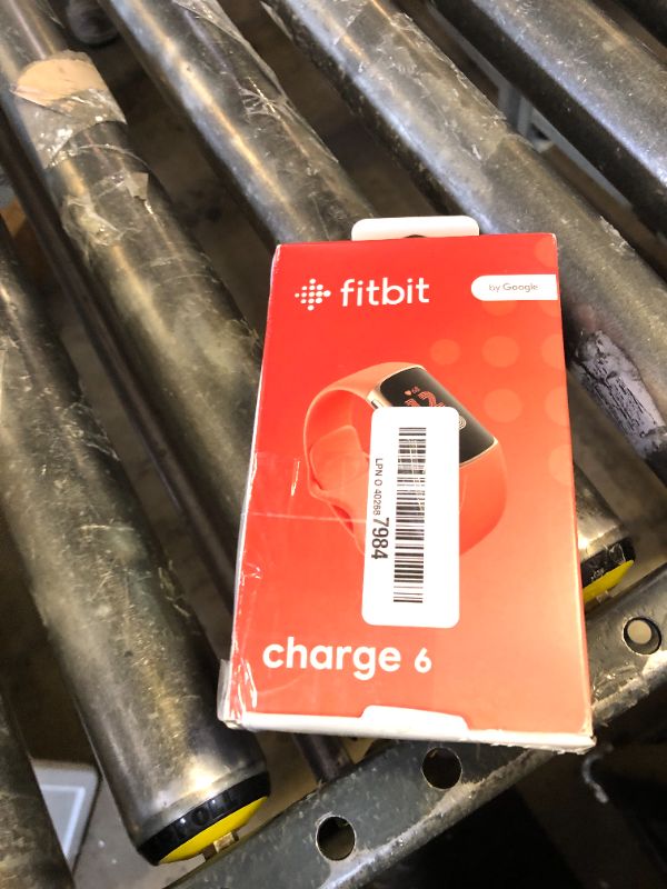 Photo 1 of Fitbit Charge 6 Fitness Tracker with Google apps, Heart Rate on Exercise Equipment, 6-Months Premium Membership Included, GPS, Health Tools and More, Gold/Coral, One Size (S & L Bands Included)