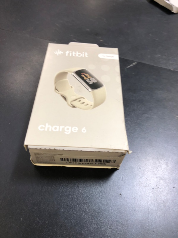 Photo 1 of Fitbit Charge 6 Fitness Tracker with Google apps, Heart Rate on Exercise Equipment, 6-Months Premium Membership Included, GPS, Health Tools and More, Porcelain/Silver, One Size (S & L Bands Included)