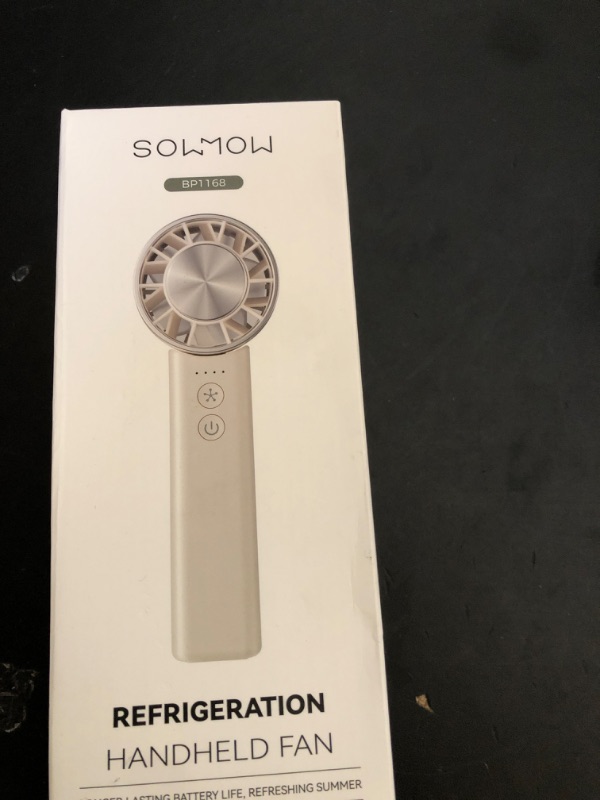Photo 1 of Sowmow Hand Held Fan - 4 Speeds Adjustable 4800mAh,Foldable,Lightweight Neck-Worn Design,Beach Vacation Essentials,Portable Fan for Travel,Cooling for Camping Outdoor and Indoor - Beige