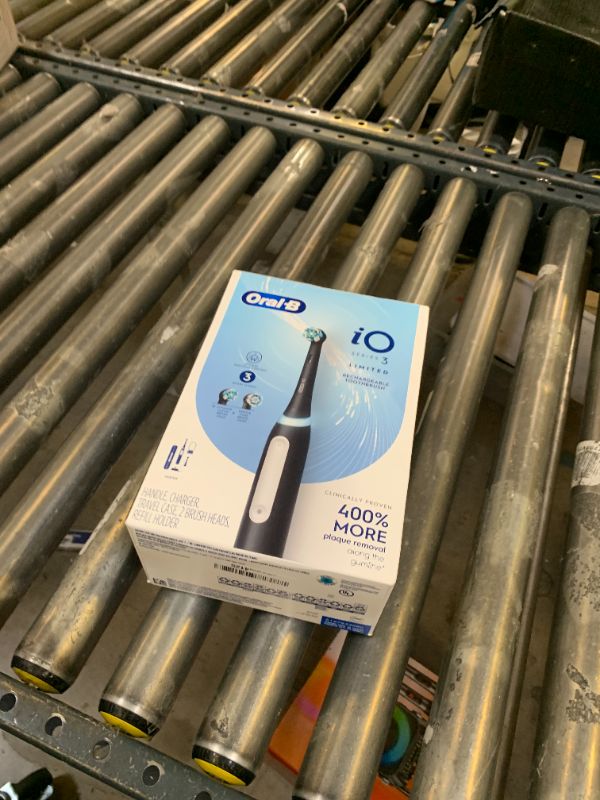Photo 1 of Oral-B iO Deep Clean Rechargeable Electric Powered Toothbrush, Black with iO Series 3 Limited, 2 Brush Heads and Travel Case - Pressure Sensor to Protect Gums - 3 Cleaning Settings - 2 Minute Timer